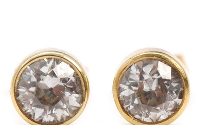 A pair of diamond earrings, each set with an old-cut diamond totalling app. 2.00 ct., mounted in 14k gold. Diam. 7.4 mm. 1994. (2)