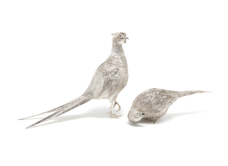 A pair of life-size silver pheasants