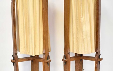 A pair of oak Arts and Crafts style standard lamps,...