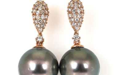 A pair of pearl and diamond ear pendants each set with a...