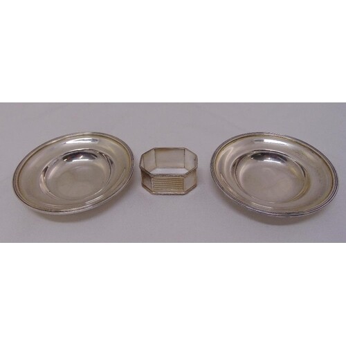 A pair of silver coasters and an engine turned napkin ring, ...