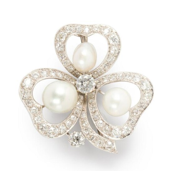 A pearl, diamond and fourteen karat white gold brooch