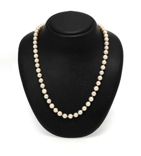 NOT SOLD. A pearl necklace set with numerous cultured pearls and a clasp set with a glass stone and diamonds, mounted in 18k gold and silver. L. app. 66 cm. – Bruun Rasmussen Auctioneers of Fine Art