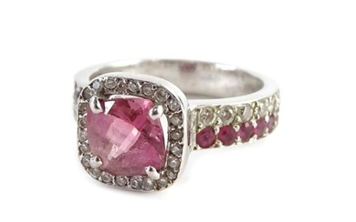 A pink sapphire and diamond dress ring, set in...