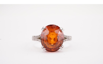 A platinum mandarin garnet set ring, set with diamond should...