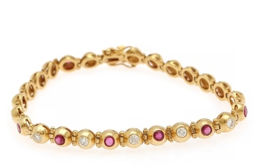 A ruby and diamond bracelet set with numerous diamonds, totalling app. 1.17 ct. and rubies, mounted in 18k gold. L. 18.5 cm. Sheffield 1994, United Kingdom.