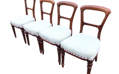 A set of four Victorian mahogany dining chairs with arched...