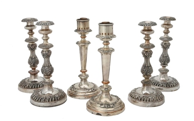 A set of four electro-plated candle sticks