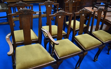 A set of seven (six plus one) early 20th Century oak dining chairs