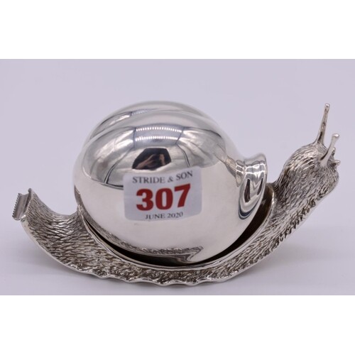 A silver novelty snail tape dispenser, by Garrard & Co L...