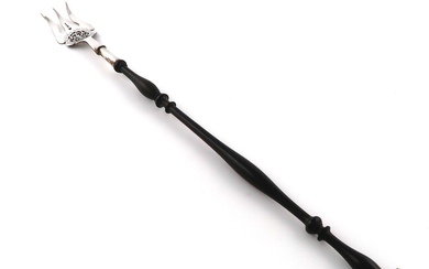 A silver toasting fork
