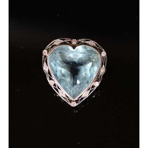 A white gold mounted heart shaped aquamarine and diamond set...