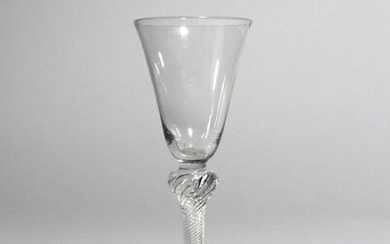 A wine glass c.1760-70, with a rounded funnel...