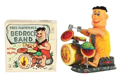 ALPS BATTERY-OPERATED FRED FLINTSTONE BEDROCK BAND TOY.