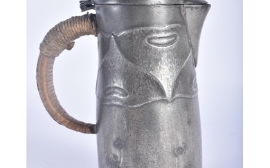 AN ARCHIBALD KNOX TYPE LIBERTY STYLE PEWTER JUG. 15 cm high.