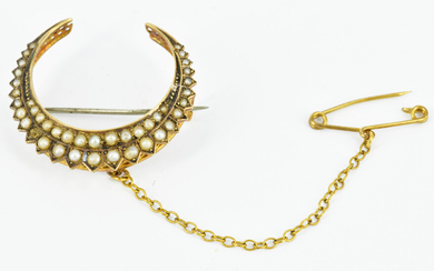 AN AUSTRALIAN HALF PEARL AND 9CT GOLD CRESCENT BROOCH
