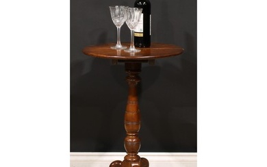 An Aesthetic Movement period elm tripod wine table, circular...