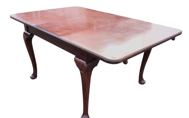 An Edwardian mahogany Ee-zi-way extending dining table with moulded rounded...