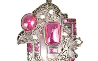 An Edwardian pendant set with an arrangement of cabochon bezel...