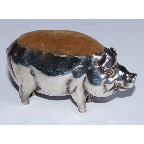 An Edwardian silver novelty pin cushion, as a pig, 8cm long,...
