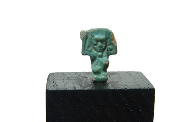 An Egyptian faience amulet of the sky god Shu