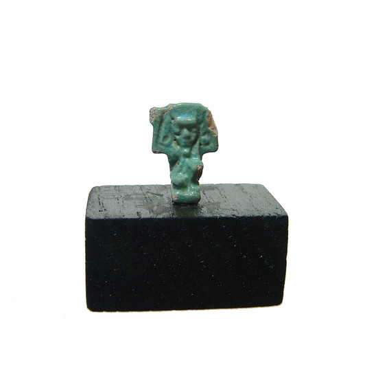 An Egyptian faience amulet of the sky god Shu
