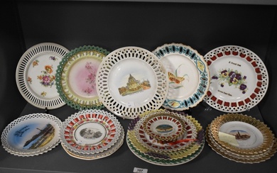 An assorted group of 19th/20th Century porcelain ribbon edged plates depicting city scenes and still