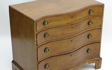 An early 19thC mahogany serpentine fronted chest of