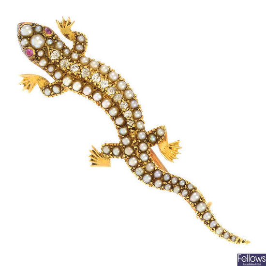 An early 20th century 15ct gold split pearl lizard brooch, with old-cut diamond line and ruby eyes.