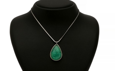 An emerald pendant set with a pear shaped cabochon emerald weighing app. 23.00 ct., mounted in 14k white gold. Accompanied by a 14k white gold necklace. (2)