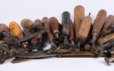 [Bookbinder's tools]. Lot of ±25 copper binding stamps, 18th-19th cent.,...