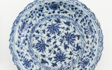 CHINESE BLUE AND WHITE MING-STYLE PORCELAIN DISH With shaped rim and passionflower design. Diameter 8.6".