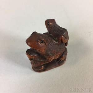 Carved Wood Netsuke of Three Frogs, Japan, signed on base "Ishikawa," ht. 1 5/8 in.