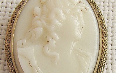 Czechoslovakia art deco carved milk glass cameo brooch in pinchbeck frame.