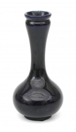 A blue glazed ceramic vase, circa 1910, marked with manufacturer's stamp underneath and M.