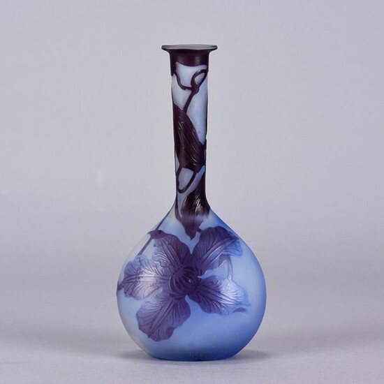 Emile Gallé (1846 ~ 1904) French Art Nouveau Cameo Glass Vase. Japanese inspired Banjo vase decorated with blue/purple flowers against a pale blue field, signed Gallé in raised cameo script. Circa 1900. Height 17.5 cm.