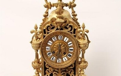 FRENCH GILT BRONZE CLOCK WITH URN AND LIONS