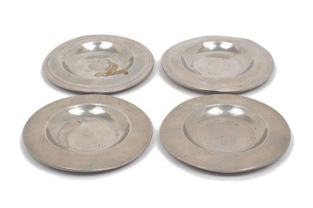 Four small pewter dishes comprising: two 19th century examples by S. Orford, London, c.1825, the undersides inscribed 'George Inn Hampton Court', and two examples with unidentified marks to rims, all four dishes approx. 11.7cm dia. (4)