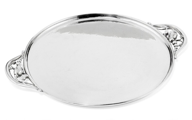 Georg Jensen: “Blossom”. Circular sterling silver serving tray with hammered surface. Georg Jensen after 1945. L. 35 cm.