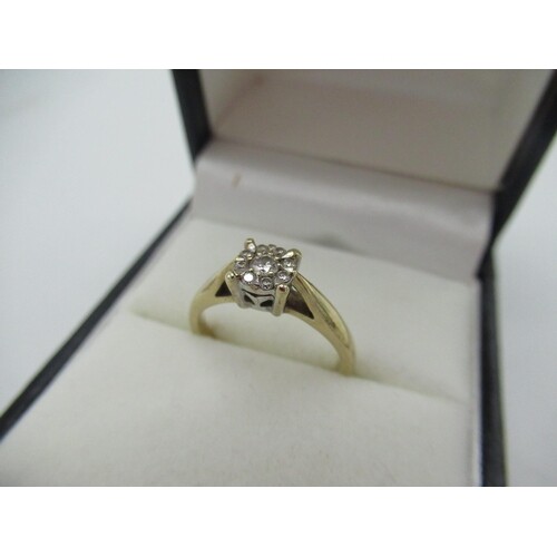 Hallmarked 9ct yellow gold ring with a central round cut dia...