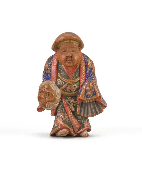 JAPANESE POLYCHROME WOOD NETSUKE By Nagamachi Shuzan. In the form of a figure carrying a mask and folded fan. Signed. Height 1.75".