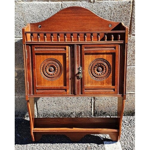 James Shoolbred of London wall-hanging cabinet, the arched b...