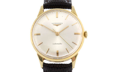 LONGINES - a yellow metal wrist watch, 34mm.