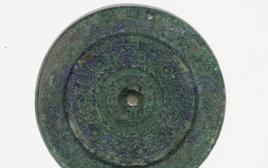Miroir circulaire en bronze à patine azurite, Chine, dynastie Han, diam. 9 cm