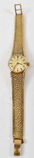 OMEGA; a 9ct yellow gold lady's wristwatch with bracelet strap.Condition...