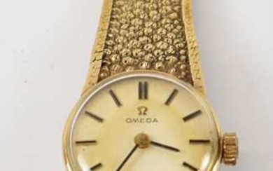 OMEGA; a 9ct yellow gold lady's wristwatch with bracelet strap.OMEGA;...