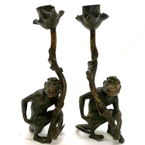 Pair of cast bronze novelty candlesticks in the form of monk...