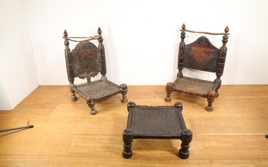 Pakistan, Swat Valley, two carved wooden low chairs and a stool