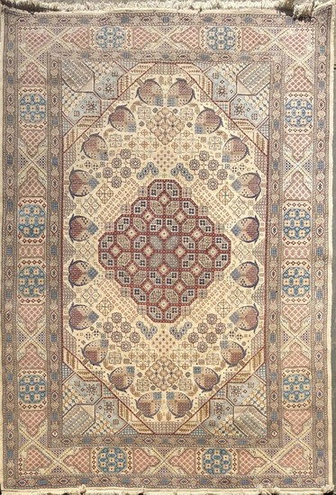 Persian Nain Wool Carpet with Silk Inlay, having floral clusters to the field and border in blue, red and beige tones (310 x 217cm)