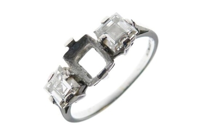 Platinum and diamond ring of two square-cut stones, each...
